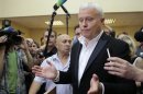 Russian media magnate Lebedev talks to media after his hearing in a courtroom in Moscow