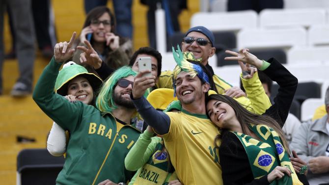 Brazil&#39;s fans take a self ire before a Copa America Group C soccer match between Brazil and Venezuela at the Monumental stadium in Santiago, Chile, Sunday, June 21, 2015. (AP Photo/Silvia Izquierdo)