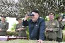 KCNA file photo showing North Korean leader Kim Jong Un looking through a pair of binoculars during inspection of Hwa Islet Defence Detachment off east coast of Korean peninsula