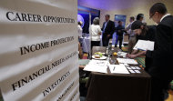 <p>               FILE - In this July 25, 2012 file photo, job seekers visit a Primerica booth at a job fair in San Jose, Calif. The number of Americans applying for unemployment benefits fell by 6,000 last week to a seasonally adjusted 361,000, a level consistent with modest gains in hiring. The Labor Department said Thursday, Aug. 9, 2012 that the less volatile four-week average rose by 2,250 to 368,250 in the week that ended Aug. 4. (AP Photo/Paul Sakuma, File)