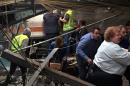 Passengers rush to safety after a NJ Transit train crashed in to the platform at the Hoboken Terminal on September 29, 2016