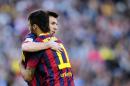 FC Barcelona's Lionel Messi, from Argentina, right, embraces to Neymar, from Brazil, during a Spanish La Liga soccer match against Betis at the Camp Nou stadium in Barcelona, Spain, Saturday, April 5, 2014. (AP Photo/Manu Fernandez)