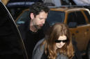 Oscar-nominated actress Amy Adams and her fiancé Darren Le Gallo arrive at a wake for actor Philip Seymour Hoffman at the Frank E. Campbell Funeral Home on Manhattan's Upper East Side, Thursday, Feb. 6, 2014, in New York. Hoffman died Sunday of a suspected drug overdose in his New York apartment. (AP Photo/Kathy Willens)