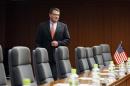 U.S. Deputy Secretary of Defense Ashton Carter walks towards his seat at the start of a meeting with Japanese Senior Vice Defence Minister Shu Watanabe in Tokyo