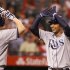 Tampa Bay Rays' Carlos Pena, right, is congratulated by Jose Lobaton  after hitting a two run home run in the eighth inning of a baseball game against the Los Angeles Angels in Anaheim, Calif., on Saturday, Aug. 18, 2012. (AP Photo/Christine Cotter)