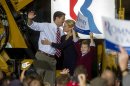 Republican vice presidential candidate Paul Ryan, R-Wis., is greeted by his wife Janna and his son Charlie, holding a sign, after his campaign speech at the Gradall Industries plant in New Philadelphia, Ohio, Saturday, Oct. 27, 2012. (AP Photo/Phil Long)