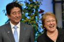 Japan's PM Shinzo Abe (L) and Chile's president MIchelle Bachelet (R) pose during a press conference at La Moneda presidential Palace in Santiago July 31, 2014