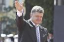 Ukraine's new president Poroshenko attends a flag raising ceremony after his inauguration in Kiev
