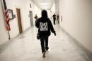A woman with a "Flint Lives Matter" shirt walks toward a hearing room where Michigan Governor Rick Snyder and EPA Administrator Gina McCarthy will testify on Capitol Hill in Washington