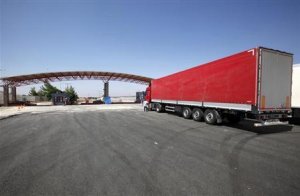 A truck is parked at the entrance of Oncupinar border …