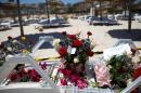 Flower bouquets are seen at the site of a shooting attack on the beach in front of the Riu Imperial Marhaba Hotel in Port el Kantaoui, south of Tunis on June 27, 2015