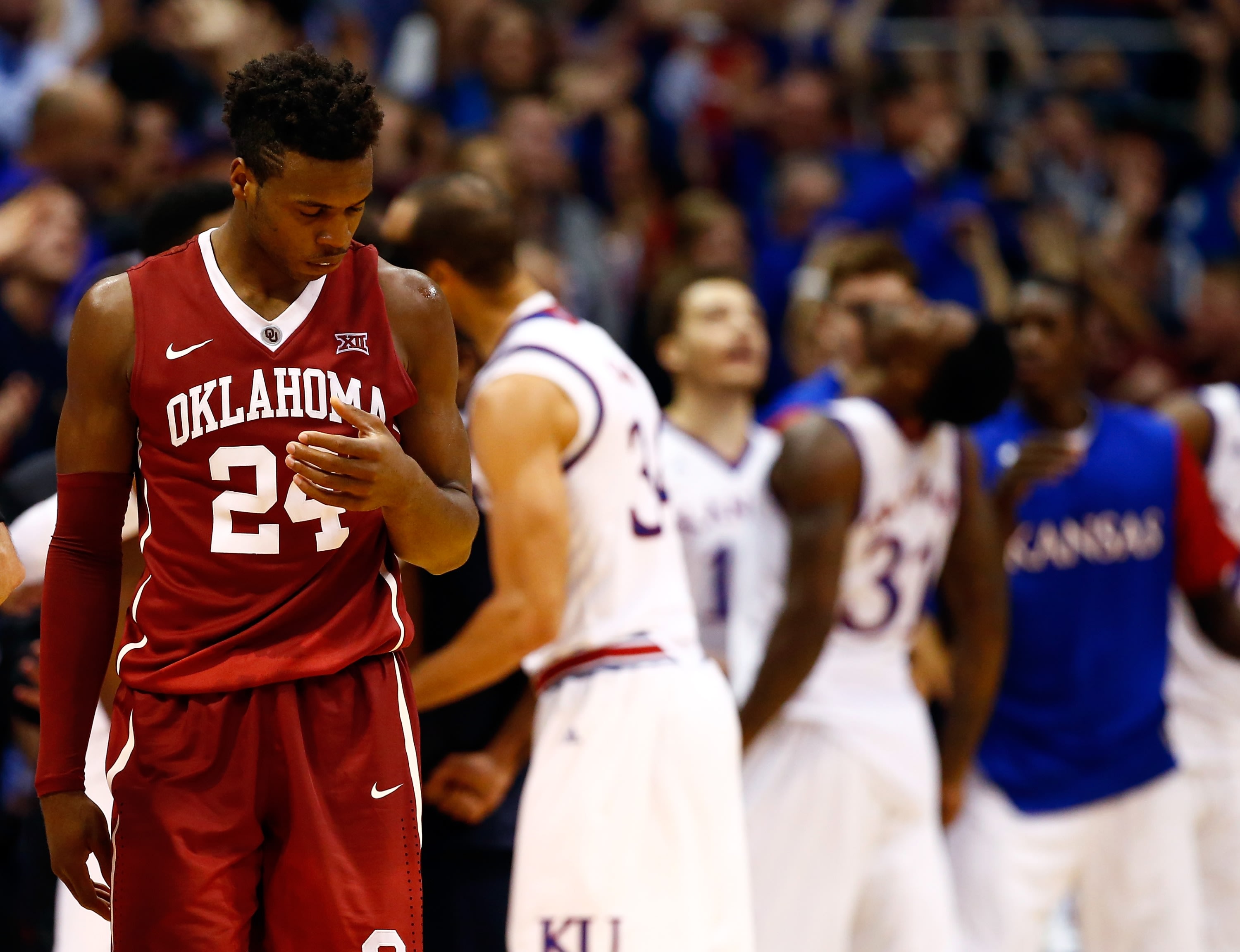 Buddy Hield reacts as Jayhawks celebrate during Oklahoma's loss. (Getty)