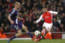 Arsenal's Alex Oxlade-Chamberlain (R) scores his team's third goal during their UEFA Champions League Group D match against Anderlecht, at the Emirates Stadium in north London, on November 4, 2014
