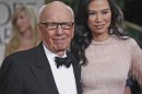 FILE This Sunday, Jan. 15, 2012, file photo shows Rupert Murdoch and his wife Wendi arrive at the 69th Annual Golden Globe Awards in Los Angeles. If the phone hacking scandal gripping Rupert Murdoch's News Corp. empire has a familiar ring, it might be because you've heard the story before. Scrappy outsider turns modest newspaper business into international media conglomerate. Ambition turns to hubris. Mogul dramatically falls from grace. (AP Photo/Matt Sayles, File)