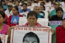 Relatives and friends of the 43 missing students of Ayotzinapa wait before experts designated to investigate the disappearance present the first conclusions, in Mexico City on September 6, 2015