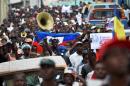 Supporters of Haitian Provisional President, Jocelerme Privert rally in Port-au-Prince, on June 14, 2016