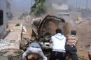 An image taken from a video uploaded on YouTube on July 20 shows men trying to extinguish a burning vehicle in Daraa