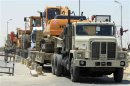 Egyptian army trucks, carrying heavy machinery to be used to destroy tunnels linking Egypt and the Gaza Strip, arrive at Rafah city
