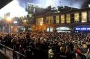 Fans gather after the Boston Red Sox won the MLB baseball's World Series at Landsdown Street near Fenway Park