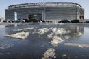 Snow and slush left from Tuesday's snowfall is seen outside MetLife stadium in East Rutherford, N.J., Wednesday, Dec. 18, 2013. Later Wednesday, at MetLife, officials demonstrated snow removal and melting machinery and outlined emergency weather scenarios and contingency plans for the Super Bowl in February. (AP Photo/Mel Evans)