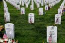 The grave marker of U.S. Army Captain Humayun Khan stands with the symbol of Islam on it amongst other grave markers inside of Section 60 in Arlington National Cemetery on Memorial Day