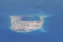Still image from a United States Navy video purportedly shows Chinese dredging vessels in the waters around Fiery Cross Reef in the disputed Spratly Islands
