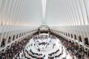 Crowds gather for a celebration for the opening of the Westfield World Trade Center mall in the oculus of the Transportation Hub, Tuesday, Aug. 16, 2016, in New York. (AP Photo/Mark Lennihan)