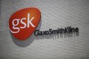 The logo of GlaxoSmithKline is seen on its office building in Shanghai
