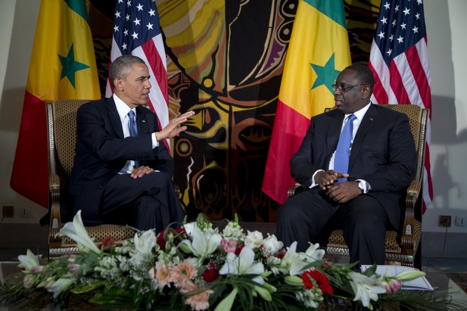 U.S. President Barack Obama, left, speaks with Senegalese President Macky Sall during a bilateral meeting at the Presidential Palace on Thursday, June 27, 2013, in Dakar, Senegal. President Obama landed in Senegal Wednesday night to kick off a weeklong trip to Africa, a three-country visit aimed at overcoming disappointment on the continent over the first black U.S. president's lack of personal engagement during his first term. (AP Photo/Evan Vucci)