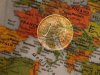 A picture illustration taken with the multiple exposure function of the camera shows a one Euro coin and a map of Europe