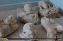 This image posted on a militant website by the Aleppo branch of the Islamic State group on Friday, July 3, 2015, which has been verified and is consistent with other AP reporting, shows items that the group claims are six smuggled archaeological pieces from the historic central town of Palmyra. An IS statement says the busts were found when the smuggler was stopped at a checkpoint and was later referred to an Islamic which ordered that they be destroyed and the man be whipped. Arabic on the caption reads, 