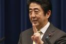Japan's PM Abe gestures during a news conference at his official residence in Tokyo