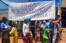 Residents attend an awareness campaign on the haemorragic fever Ebola by local authorities in Lelouma, near Labe, western Guinea on September 27, 2014