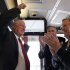 Illinois Gov. Pat Quinn, left, U.S. Transportation Sec. Ray LaHood, center, and US Sen. Dick Durbin, D-Ill., celebrate after the Amtrak train they are riding reached 110 mph during a test run between Dwight and Pontiac, Ill., on Friday, Oct. 19, 2012, in Pontiac, Ill.  (AP Photo/Charles Rex Arbogast)