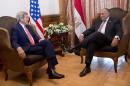 U.S. Secretary of State John Kerry meets with Egypt Foreign Minister Sameh Shoukry in Cairo, Egypt, Sunday, Oct. 12, 2014, before a working breakfast during the Gaza Donor Conference. (AP Photo/Carolyn Kaster, Pool)