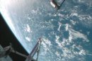This framegrabbed image provided by NASA-TV shows the Cygnus spacecraft at the 30 meter hold point from the International Space Station Sunday Sept. 29, 2013 as both cross over the Atlantic Ocean. (AP Photo/NASA-TV)