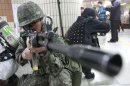 FILE - In this Monday, April 15, 2013 file photo, a South Korean army soldier aims his machine gun during an anti-terrorism drill against possible terrorists' attacks at a subway station in Seoul, South Korea. In his 16 months on the job, North Korean leader Kim Jong Un's government has raised fears with unusually aggressive threats against Seoul and Washington, and it's not clear whether he will be able to pull back, a feat perfected by his late father, considered a master at brinkmanship. The mystery surrounding Kim's intentions has some outsiders predicting nightmare scenarios. (AP Photo/Ahn Young-joon, File)