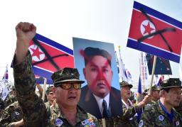South Korean veterans hold placards showing&nbsp;&hellip;