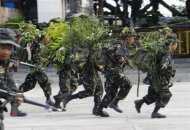 Cadets of the Philippine Military Academy (PMA) run during a joint field training exercise at the marines headquarters in Ternate, Cavite city, south of Manila May 29, 2013. REUTERS/Romeo Ranoco