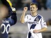 Los Angeles Galaxy midfielder Rogers fist pumps the team's mascot Cozmo after playing in the MLS soccer game against the Seattle Sounders in Carson