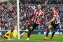 Sunderland striker Connor Wickham (2nd right) wheels away in celebration after scoring his team's fourth goal during the Premier League match between Sunderland and Cardiff City at Stadium of Light in Sunderland on April 27, 2014