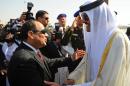 Egyptian President Abdel Fattah al-Sisi, left, greets Qatar's Emir Sheikh Tamim bin Hamad Al-Thani, on his arrival to attend an Arab summit, in Sharm el-Sheikh, South Sinai, Egypt, Saturday, March 28, 2015. In a speech to Arab leaders, Yemen's embattled president on Saturday called Shiite rebels who forced him to flee the country "puppets of Iran," directly blaming the Islamic Republic for the chaos there and demanding airstrikes against rebel positions continue until they surrender. (AP Photo/MENA)