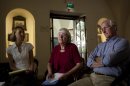 Cindy, center, and Craig Corrie, right, the parents of Rachel Corrie, a pro-Palestinian activist who was killed by an Israeli bulldozer in Gaza in 2003, sit together with their daughter Sarah, during an interview with the Associated Press in Jerusalem, Sunday, Aug. 26, 2012. Almost a decade after their daughter was crushed to death by an Israeli army bulldozer as she tried to block its path in a Gaza Strip war zone, Rachel Corrie's parents are bracing for the judge's ruling in their high-profile civil lawsuit against the military. (AP Photo/Sebastian Scheiner)