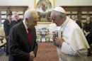 Pope Francis greets Israeli President Peres during private meeting at the Vatican