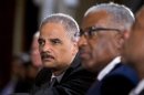 Attorney General Eric Holder, left, attends a ceremony on Capitol Hill in Washington, Wednesday, July 31, 2013, in observance of the 50th anniversary of the March on Washington for Jobs and Freedom. (AP Photo/Manuel Balce Ceneta)