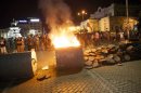 Protesters burn a barricade outside the parliament building in Sofia