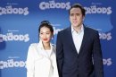Cast member Nicolas Cage and wife Alice Kim arrive for the premiere of the film "The Croods" in New York