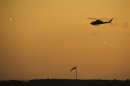 An Israeli Cobra helicopter fires missiles at targets during the air force pilots' graduation ceremony at Hatzerim air base
