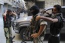 Free Syrian Army fighters prepare for an offensive against forces loyal to Syria's President Bashar al-Assad, in Aleppo's Salaheddine neighborhood