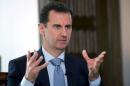 Syria's President Bashar al-Assad speaks during an interview with Russia's RIA news agency